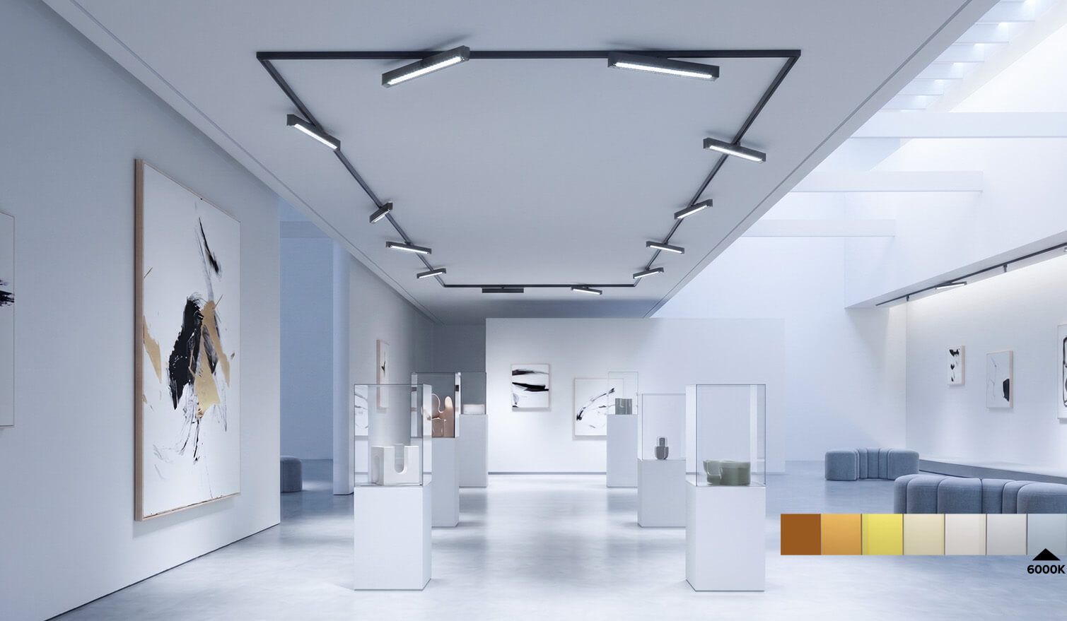 Une salle spacieuse aux murs blancs, ornée de nombreuses œuvres d'art, propice à la créativité et à la réflexion