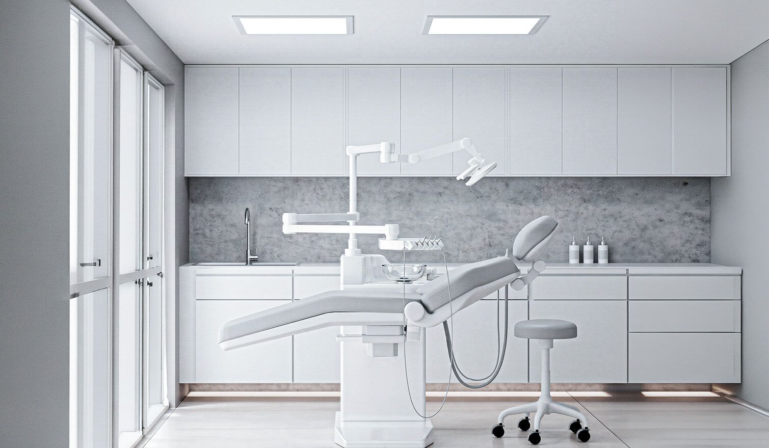 Intérieur d'un cabinet dentaire avec des murs blancs et un fauteuil dentaire prêt pour les soins dentaires | Lumedic